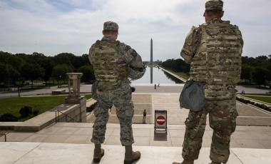 In this June 3, 2020 file photo members of the District of Columbia Army National Guard stand guard at the Lincoln Memorial in Washington securing the area as protests continue following the death of George Floyd, a who died after being restrained by Minneapolis police officers. An Ohio National Guardsman was removed from policing protests in Washington D.C. after the FBI found he expressed white supremacist ideology online, Gov. Mike DeWine announced in a briefing Friday, June 5, 2020. 