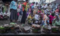 Displaced Ethiopians from different towns in the Amhara region wait for food to be distributed at lunchtime at a center for the internally-displaced in Debark, in the Amhara region of northern Ethiopia 