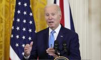 President Joe Biden speaks during a news conference in the East Room of the White House in Washington