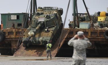 South Korean army's K-55 self-propelled artillery vehicle is unloaded from a barge during a Combined Joint Logistics Over-the-Shore exercise of U.S. and South Korea Combined Forces Command at the Anmyeon beach in Taean, South Korea, Monday, July 6, 2015. The U.S. and South Korean military joint exercise are held from June 29to July 9.