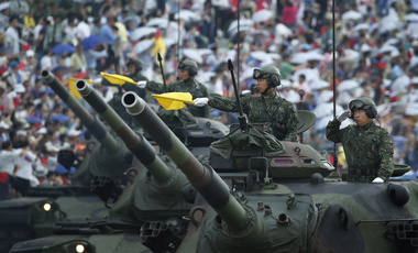 Taiwan's military displays tanks in a parade in Hsinchu, northern Taiwan, Saturday, July 4, 2015.