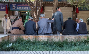 Uighur men sit in Kashgar.
