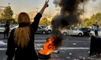 Iranians protest near traffic
