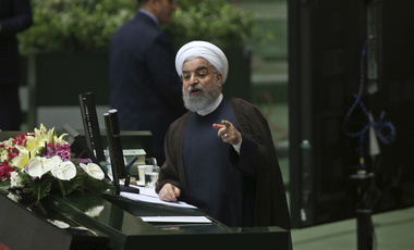 Hassan Rouhani speaks in a session of parliament
