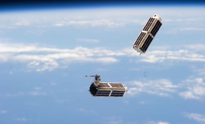 A set of NanoRacks CubeSats is photographed by an Expedition 38 crew member after the deployment by the Small Satellite Orbital Deployer (SSOD).