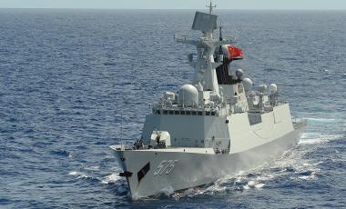 People's Liberation Army (Navy) frigate PLA(N) Yueyang (FF 575) steams in formation with 42 other ships and submarines during Rim of the Pacific (RIMPAC) Exercise 2014.